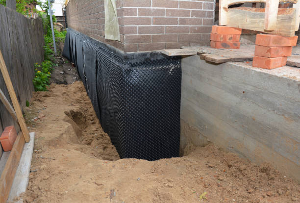 SJ Waterproofing Pros technician performing targeted Interior Drainage System assessment in Schofield, WI